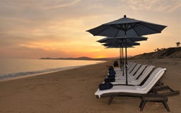 Sunset With Beach Chairs Stock Photo