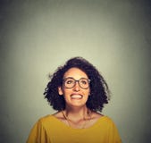 Super excited happy girl in glasses looking up stock photos Super excited happy girl in glasses looking up stock photos