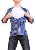 Super héroe. Hombre joven que rasga su camisa apagado aislada encendido fotos de archivo Super héroe. Hombre joven que rasga su camisa apagado aislada encendido fotos de archivo