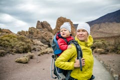 Super Mom With Baby Boy Hiking In Backpack Royalty Free Stock Photography