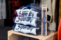 Superdry logo brand and sign text in windows facade clothes store of British fashion