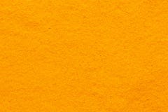 Superficie regolare della struttura completa della polvere della spezia della curcuma della curcuma immagini stock libere da diritti Superficie regolare della struttura completa della polvere della spezia della curcuma della curcuma immagini stock libere da diritti