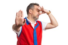 Supermarktwerknemer die brutogeurgebaar maken royalty-vrije stock afbeelding Supermarktwerknemer die brutogeurgebaar maken royalty-vrije stock afbeelding