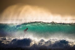 Surfer on Blue Ocean Wave in Bali Stock Photos Surfer on Blue Ocean Wave in Bali Stock Photos