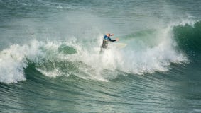 Surfer riding crest of wave, Fistral, Newquay, Cornwall royalty free stock photos Surfer riding crest of wave, Fistral, Newquay, Cornwall royalty free stock photos