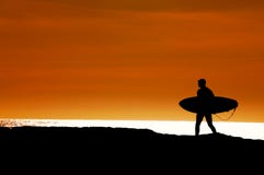 Surfer Walking To The Ocean Stock Photography