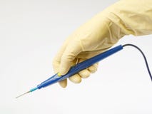 Surgeon holding a blue electric scalpel Royalty Free Stock Images Surgeon holding a blue electric scalpel Royalty Free Stock Images
