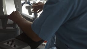 Surgeon operating robotic surgery machine, Minimally Invasive Da Vinci System
