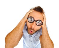 Surprised expression of a young man with thick glasses Stock Images Surprised expression of a young man with thick glasses Stock Images