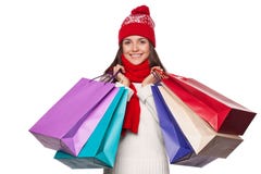 Surprised happy beautiful woman holding shopping bags in excitement. Christmas girl on winter sale, isolated on white background royalty free stock photos Surprised happy beautiful woman holding shopping bags in excitement. Christmas girl on winter sale, isolated on white background royalty free stock photos