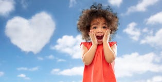 Surprised little african american girl over sky royalty free stock photos Surprised little african american girl over sky royalty free stock photos