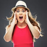 Surprised woman in red dress studio portrait. Royalty Free Stock Image Surprised woman in red dress studio portrait. Royalty Free Stock Image