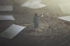 Surreal woman decides which page to choose for the end of her book stock images Surreal woman decides which page to choose for the end of her book stock images