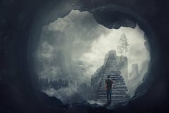 Surreal view as a man escape from a dark cave climbing a mystic stairway crossing the misty abyss going up to unknown paradise