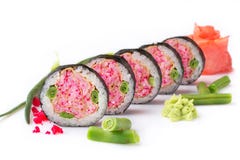 Sushi roll turned on a white background. Sushi Japanese food in a restaurant. Japanese restaurant menu. Unusual pink stock photography Sushi roll turned on a white background. Sushi Japanese food in a restaurant. Japanese restaurant menu. Unusual pink stock photography