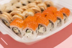 Sushi rolls in a white plastic lunch box takeaway royalty free stock image Sushi rolls in a white plastic lunch box takeaway royalty free stock image