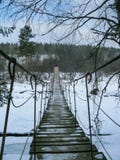 Suspension bridge across the river in the natural park Olenyi brooks in the Sverdlovsk region royalty free stock photos Suspension bridge across the river in the natural park Olenyi brooks in the Sverdlovsk region royalty free stock photos