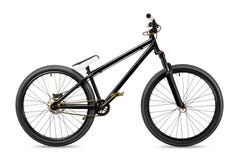 Svart guld- cykel för slopestylesmutshopp Fotografering för Bildbyråer Svart guld- cykel för slopestylesmutshopp Fotografering för Bildbyråer