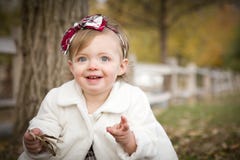 Sweet Baby Girl Playing In Park Royalty Free Stock Photography