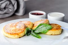 Sweet Delicious Cottage Cheese Pancakes, Syrniki, Curd Fritters Stock Images Sweet Delicious Cottage Cheese Pancakes, Syrniki, Curd Fritters Stock Images