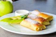 Sweet Dessert Pancakes With Apples And Powdered Sugar O Royalty Free Stock Images