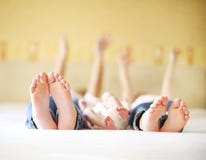 Sweet Family In Bed. Three Sisters, Close Up On Feet Stock Photography