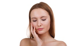 A sweet girl, stroking her face with hand and looking down. Isolation. royalty free stock photography A sweet girl, stroking her face with hand and looking down. Isolation. royalty free stock photography