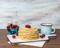 Sweet Homemade Stack of Pancakes with cherries royalty free stock photo Sweet Homemade Stack of Pancakes with cherries royalty free stock photo