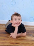 Sweet Little Boy Laying On Floor With Hand On Chin Royalty Free Stock Photo Sweet Little Boy Laying On Floor With Hand On Chin Royalty Free Stock Photo