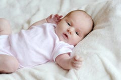 Sweet little newborn baby in a bed royalty free stock images Sweet little newborn baby in a bed royalty free stock images