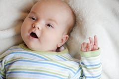 Sweet little newborn baby in a bed stock images Sweet little newborn baby in a bed stock images