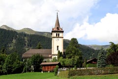 Sweet Little Swiss Parish Church And Churchyard Stock Photo