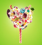 Sweet Lolipop In Heart Form Of Whipped Cream With Sweets, Jellies, Heart Front View. Crazy Freakshake Food Trend. Front Stock Photography