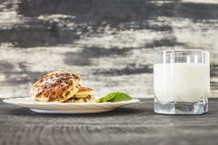 Sweet pancakes and a glass of milk royalty free stock photography Sweet pancakes and a glass of milk royalty free stock photography