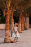 Sweet smiling girl near the palm trees on vacation stock images Sweet smiling girl near the palm trees on vacation stock images