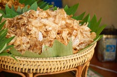 Sweet taro crisps in the wooden basket. stock photo Sweet taro crisps in the wooden basket. stock photo