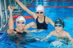 The swimming coach shows exercises for children royalty free stock images The swimming coach shows exercises for children royalty free stock images