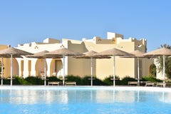 Swimming pool area with umbrellas in the hotel stock photography Swimming pool area with umbrellas in the hotel stock photography