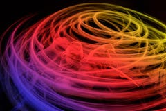 Swirling multi color light around the shoes on dark background Stock Photo Swirling multi color light around the shoes on dark background Stock Photo