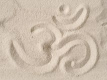 Symbole de l'OM en sable photos stock Symbole de l'OM en sable photos stock