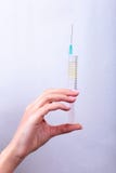Syringe, medical injection in hand, palm or fingers. Medicine plastic vaccination equipment with needle. Nurse doctor Royalty Free Stock Photo Syringe, medical injection in hand, palm or fingers. Medicine plastic vaccination equipment with needle. Nurse doctor Royalty Free Stock Photo