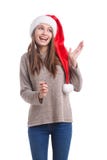 Szczęśliwych bożych narodzeń dziewczyna jest ubranym Santa kapelusz odizolowywającego na białym tle Wakacje pojęcie obraz royalty free Szczęśliwych bożych narodzeń dziewczyna jest ubranym Santa kapelusz odizolowywającego na białym tle Wakacje pojęcie obraz royalty free