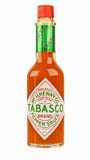 Szklana butelka czerwony Tabasco chili kumberland Zdjęcie Stock Szklana butelka czerwony Tabasco chili kumberland Zdjęcie Stock