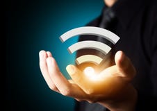 Símbolo social de la tecnología de red de Wifi en mano del hombre de negocios imagen de archivo Símbolo social de la tecnología de red de Wifi en mano del hombre de negocios imagen de archivo