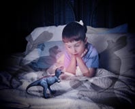 T-Rex Dinosaur on Child's Scary Bed royalty free stock photo T-Rex Dinosaur on Child's Scary Bed royalty free stock photo