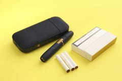 Download Tabacco Heating System Cigarette Pack And Sticks On Yellow Background Stock Photo Image Of Cigarette Backgrounds 136500620 PSD Mockup Templates