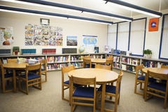 Table And Chairs Arranged In High School Library