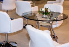 Table glass white armchair Stock Image Table glass white armchair Stock Image