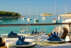 Table settings at restaurant on seaside