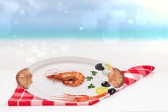 Table top on seafood background. A Fresh grilled big prawn tiger or shrimps on a white table in front of abstract blurred tropical stock photos Table top on seafood background. A Fresh grilled big prawn tiger or shrimps on a white table in front of abstract blurred tropical stock photos